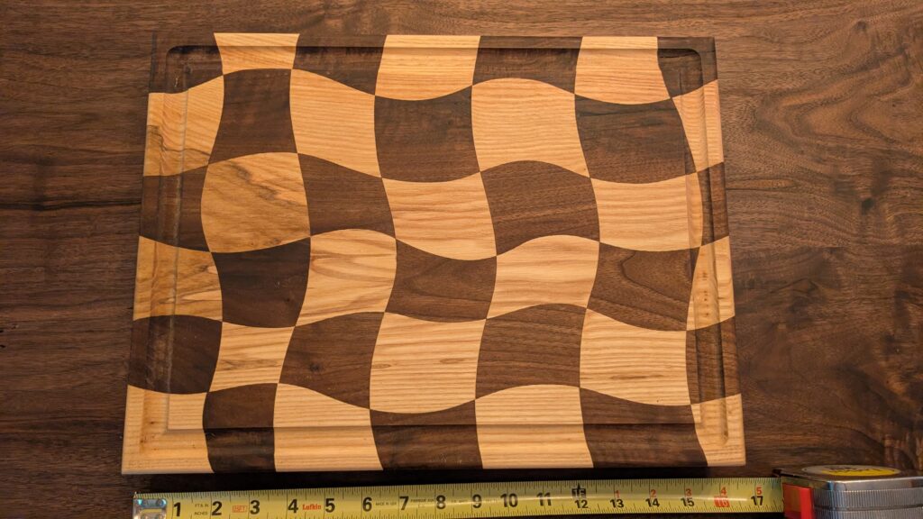 Black Walnut and Ash decorative wavy cutting board